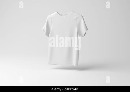 T-shirt bianca che galleggia a mezz'aria su sfondo bianco, monocromatica e minimalista. Concetto di industria tessile, moda e abbigliamento casual Foto Stock