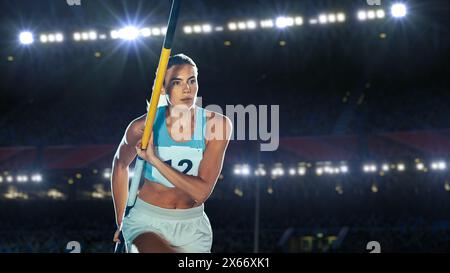 Salto con la pole Vault: Ritratto dell'atleta femminile professionista nel Campionato del mondo di corsa con Pole to Jump Over Bar. Shot of Competition al Big Stadium con esperienza di realizzazione sportiva Foto Stock