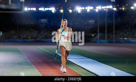 Salto con la pole Vault: Ritratto dell'atleta femminile professionista nel Campionato del mondo di corsa con Pole to Jump Over Bar. Shot of Competition al Big Stadium con esperienza di realizzazione sportiva Foto Stock