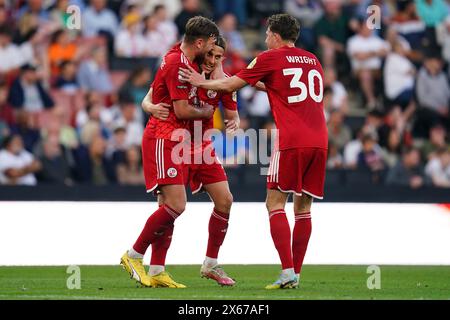 Danilo Orsi di Crawley Town (seconda a sinistra) festeggia con Laurence Maguire e Will Wright dopo aver segnato il secondo gol della squadra durante la semifinale di Sky Bet League due, partita di andata e ritorno allo stadio MK, Milton Keynes. Data foto: Sabato 11 maggio 2024. Foto Stock