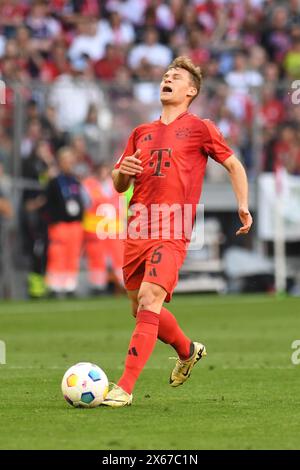 Monaco, Germania. 13 maggio 2024. MONACO, GERMANIA - 12 MAGGIO: Joshua Kimmich del Bayern Muenchen durante la partita di Bundesliga tra il Bayern Muenchen e il Wolfsburg all'Allianz Arena il 12 maggio 2024 a Monaco, Germania.240512 SEPA 24 063 - 20240513 PD5657 credito: APA-PictureDesk/Alamy Live News Foto Stock