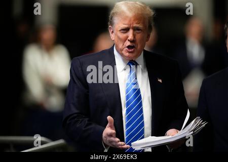 New York, Stati Uniti. 13 maggio 2024. L'ex presidente Donald Trump parla ai giornalisti mentre lascia il processo alla Manhattan Criminal Court di New York lunedì 13 maggio 2024. Michael Cohen, un ex fissatore e avvocato personale di Trump, ha iniziato a testimoniare nel processo penale contro l'ex presidente. Foto della piscina di Seth Wenig/UPI credito: UPI/Alamy Live News Foto Stock