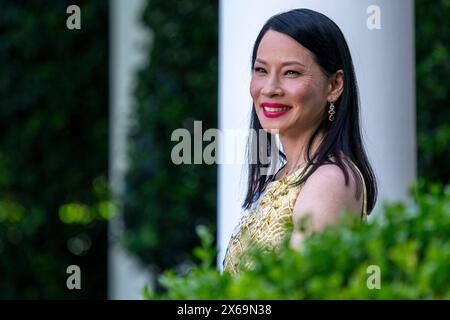 Washington, Stati Uniti. 13 maggio 2024. L'attrice americana Lucy Liu guarda durante un ricevimento che celebra il mese del patrimonio asiatico-americano, dei nativi hawaiani e del Pacifico Islander nel Rose Garden, la Casa Bianca a Washington, DC, USA, 13 maggio 2024. Crediti: Abaca Press/Alamy Live News Foto Stock