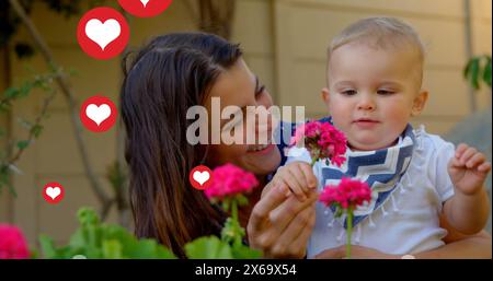 Immagine delle icone del cuore sulla madre caucasica con il bambino Foto Stock