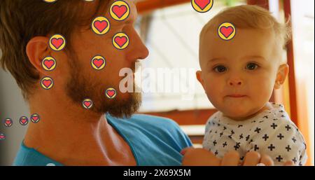 Immagine di icone del cuore sopra il padre caucasico con il bambino Foto Stock