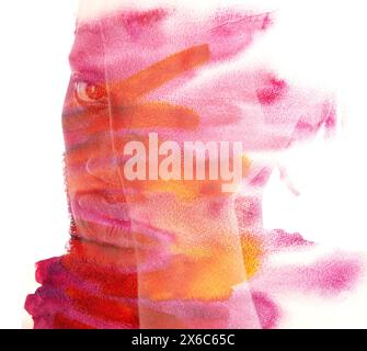 Una colorata silhouette ritratto di un giovane uomo Foto Stock