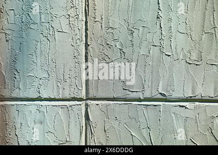Dettagli delle pareti in cemento testurizzato con luce naturale Foto Stock