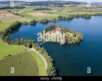 Aerial view of the Mauern Lake with an old, little castle on the small island Foto Stock