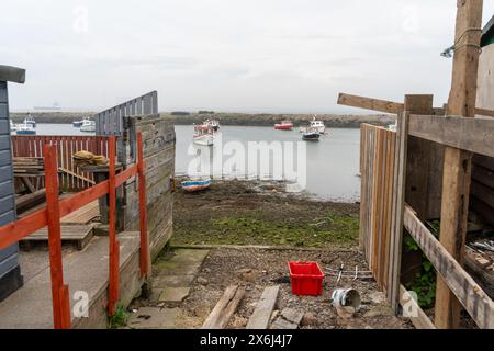 Stazione sud, nr. Redcar, North Yorkshire, Regno Unito. Cantiere navale in un piccolo porto conosciuto localmente come Paddy's Hole. Foto Stock