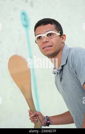 giocatore maschile in partita di squash Foto Stock