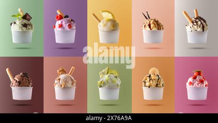 Assortimento di gelati di frutta naturale con palla decorata in tazza di carta bianca e sfondi colorati. Foto Stock