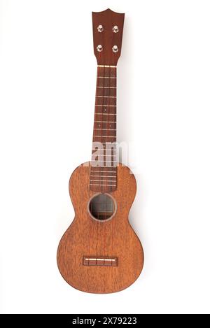 Ukulele vintage su bianco isolato Foto Stock