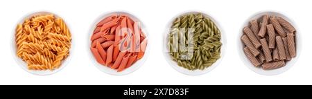 Varianti di pasta senza glutine in ciotole bianche. Spaghetti senza farina di grano. Fusilli di ceci, penne di lenticchie rosse, fusilli di pisello verde e tortiglion di grano saraceno Foto Stock