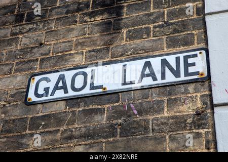 Cartello stradale per Gaol Lane nella storica città di Sudbury nel Suffolk, Regno Unito. Foto Stock