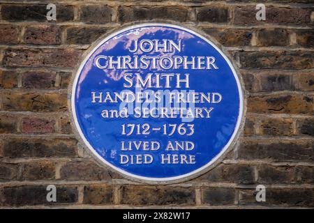 Londra, Regno Unito - 15 gennaio 2024: Una targa blu su Carlisle Street a Londra, Regno Unito, che segna il luogo in cui il segretario di Handel John Christopher Smith l Foto Stock