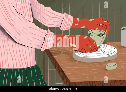 L'argilla di stampaggio artigianale su una ruota di ceramica in officina Foto Stock