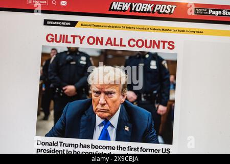 Reazione online istantanea sul New York Post (USA) in quanto l'ex presidente Trump viene dichiarato colpevole e condannato per 34 reati, il 30 maggio 2024. Foto Stock