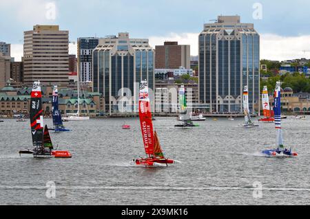 SailGP F50 catamarani che sventolano mostrati ad Halifax Harbour durante il ROCKWOOL Canada Sail Grand Prix 2024 ad Halifax, Canada Foto Stock