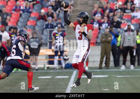 Ottawa, Canada. 31 maggio 2024. Il quarterback degli Ottawa Redblacks Dru Brown (3) lancia la palla durante la gara di pre-stagione della CFL tra Montreal Alouettes e Ottawa Redblacks tenutasi al TD Place Stadium di Ottawa, Canada. Daniel Lea/CSM/Alamy Live News Foto Stock