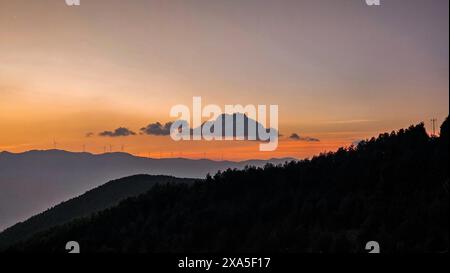 Un tramonto su Damakan nel distretto di Dongchuan, Kunming City, Yunnan, Cina Foto Stock