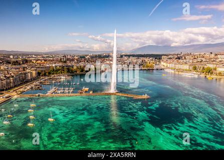 Una vista aerea panoramica della fontana d'acqua di Ginevra con le barche in primo piano. Foto Stock