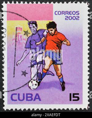 Francobollo cancellato stampato da Cuba, che mostra il giocatore di calcio spagnolo, Coppa del mondo FIFA 2002 - Corea e Giappone, circa 2002. Foto Stock