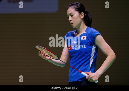 Aya Ohori del Giappone in azione durante il match singolo del terzo giorno del Kapal API Indonesia Open contro Chen You Fei della Cina all'Istora Gelora Foto Stock