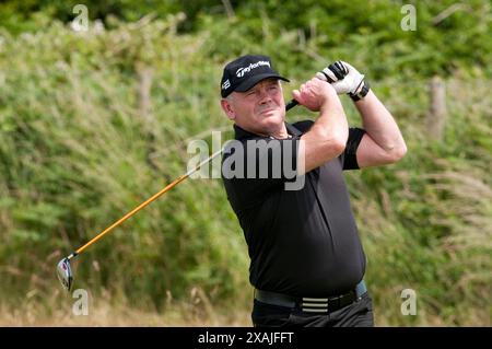 L' ex rugby gallese internazionale Ieuan Evans completa oggi la sfida a 100 buche al Royal Porthcawl Golf Club ( martedì 29 / 6 / 10 ) Foto Stock