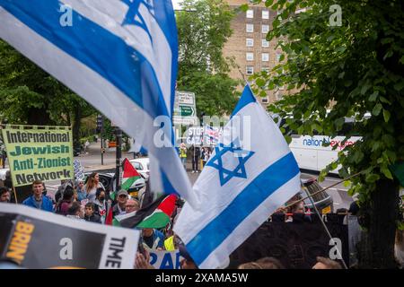 Swiss Cottage, Londra, 7 giugno 2024. Manifestazione pro palestinese con contro manifestazione pro israeliana “basta” che chiede alla polizia metropolitana di porre fine a tutte le marce pro palestinesi che sembrano sostenere il terrorismo di Hamas e la distruzione di Israele dall’inizio della guerra Israele/Hamas il 7 ottobre 2023. I sostenitori pro palestinesi al raduno sono stati i sostenitori pro israeliani. Crediti: Rena Pearl/Alamy Live News Foto Stock