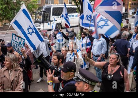 Swiss Cottage, Londra, 7 giugno 2024. Manifestazione pro palestinese con contro manifestazione pro israeliana “basta” che chiede alla polizia metropolitana di porre fine a tutte le marce pro palestinesi che sembrano sostenere il terrorismo di Hamas e la distruzione di Israele dall’inizio della guerra Israele/Hamas il 7 ottobre 2023. I sostenitori pro palestinesi al raduno sono stati i sostenitori pro israeliani. Crediti: Rena Pearl/Alamy Live News Foto Stock