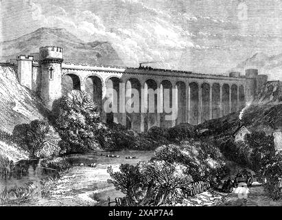 Il viadotto di Knucklass, Central Wales Railway, 1865. Ponte ferroviario sulla linea tra Knighton e Llandrindod nel Radnorshire, '...bringing le contee di midland in Inghilterra per una comunicazione più diretta con i distretti minerari del Galles meridionale, e rendendo i piacevoli luoghi di irrigazione e il pittoresco scenario del Galles del Sud più accessibili di quanto non lo siano stati finora... gli appaltatori, i signori Hattersley e Morton, hanno dovuto eseguire lavori pesanti in profonde incisioni e argini. Partendo da Knighton, la linea costeggia la città lungo il percorso della valle del tema, che segue Foto Stock