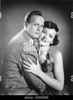 Un ritratto pubblicitario di RICHARD WIDMARK e GENE TIERNEY per LA NOTTE E LA CITTÀ 1950 regista JULES DASSIN romanzo GERALD KERSH Cinematography MUTZ GREENBAUM nel ruolo di MAX GREENE Twentieth Century Fox Foto Stock