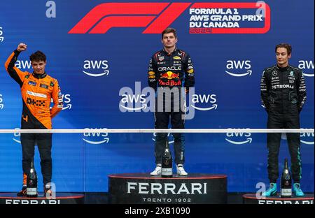 Montreal, Canada. 9 giugno 2024. Al primo posto il pilota olandese della Red Bull Racing Max Verstappen (C), al secondo posto il pilota inglese della McLaren Lando Norris (L) e al terzo posto il pilota britannico della Mercedes George Russell posato sul podio dopo la gara del Gran Premio di Formula uno del Canada 2024 sul circuito Gilles-Villeneuve di Montreal, Canada, 9 giugno 2024. Crediti: Qian Jun/Xinhua/Alamy Live News Foto Stock