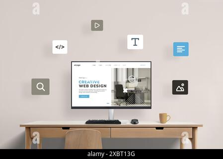 Scrivania con display per computer con pagina di presentazione di uno studio di web design, circondata da icone di web design volanti. Rappresentazione visiva di una creatura Foto Stock