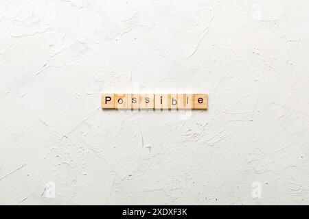Possibile parola scritta sul blocco di legno. testo possibile sul tavolo, concetto. Foto Stock