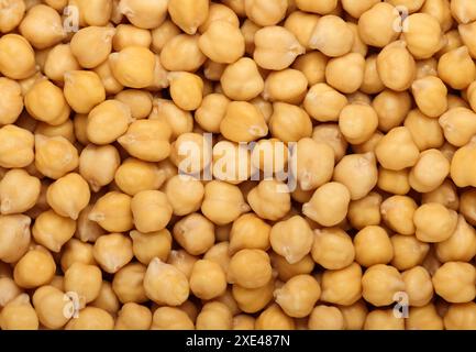Cucinato imbevuto di ceci fagioli close up sullo sfondo Foto Stock