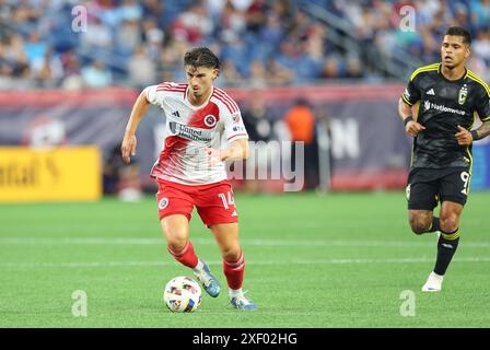 29 giugno 2024; Foxborough, ma, USA; Ian Harkes, centrocampista della New England Revolution (14) in azione durante il match MLS tra Columbus Crew e New England Revolution. Anthony Nesmith/CSM Foto Stock