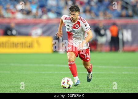 29 giugno 2024; Foxborough, ma, USA; Ian Harkes, centrocampista della New England Revolution (14) in azione durante il match MLS tra Columbus Crew e New England Revolution. Anthony Nesmith/CSM Foto Stock