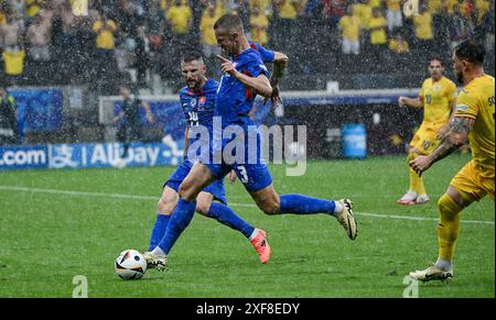 Francoforte, Germania. 26 giugno 2024. 26.06.2024, xpsx, turno preliminare UEFA Euro 2024, Slovacchia - Romania da sinistra a destra (LE NORMATIVE DFL/DFB VIETANO QUALSIASI USO DI FOTOGRAFIE come SEQUENZE DI IMMAGINI e/o QUASI-VIDEO) crediti: dpa/Alamy Live News Foto Stock