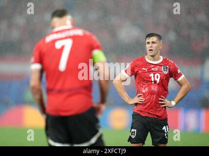 L'austriaco Christoph Baumgartner (a destra) reagisce durante la partita UEFA Euro 2024, nella fase di 16 partite allo Stadio di Lipsia, in Germania. Data foto: Martedì 2 luglio 2024. Foto Stock