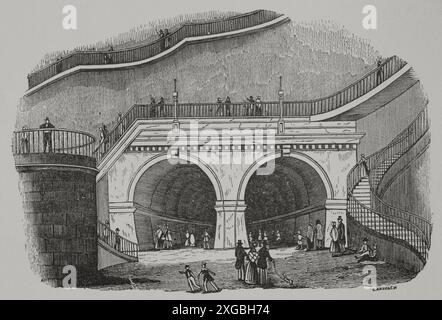 Londra, Inghilterra. Tunnel del Tamigi. Galleria che attraversa sotto il Tamigi, collegando i quartieri di Rotherhithe e Wapping. Fu costruita tra il 1825 e il 1843 da Marc Brunel (1769-1849) e suo figlio Isambard Kingdom Brunel (1806-1859). Aperto il 25 marzo 1843. Ingresso Rotherhithe. Incisione di Cabanach. "Los Héroes y las Grandezas de la Tierra" (gli eroi e i magnifici della Terra). Volume VIII. 1856. Autore: Cabanach. incisore del xix secolo. Foto Stock