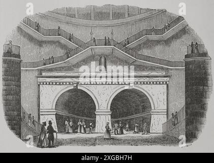 Londra, Inghilterra. Tunnel del Tamigi. Galleria che attraversa sotto il Tamigi, collegando i quartieri di Rotherhithe e Wapping. Fu costruita tra il 1825 e il 1843 da Marc Brunel (1769-1849) e suo figlio Isambard Kingdom Brunel (1806-1859). Aperto il 25 marzo 1843. Ingresso Wapping. Incisione di Cabanach. "Los Héroes y las Grandezas de la Tierra" (gli eroi e i magnifici della Terra). Volume VIII. 1856. Autore: Cabanach. incisore del xix secolo. Foto Stock