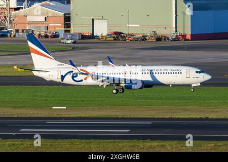 Rex Airlines Boeing 737 atterra all'aeroporto di Sydney. Aereo B737 della compagnia aerea Rex Airlines in arrivo. 737-800 aereo. Foto Stock