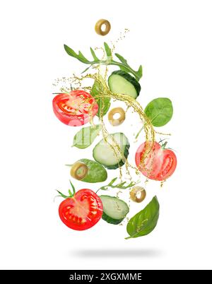 Verdure fresche e olio per insalata all'aria su sfondo bianco Foto Stock