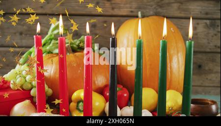 Immagine di stelle dorate su candele e zucche kwanzaa. Il concetto di festa, celebrazione e tradizione Kwanzaa è un'immagine generata digitalmente. Foto Stock