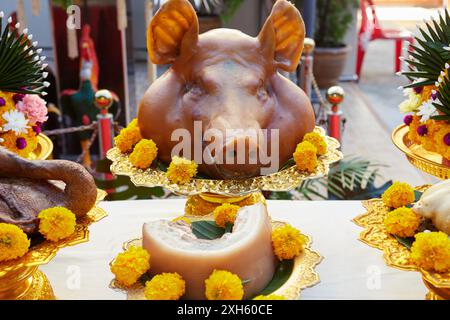 Pig’s head for offerings to pay respect god Stock Photo