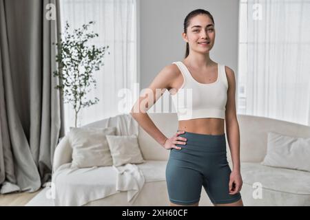 portrait of young woman  doing workout training at home Stock Photo