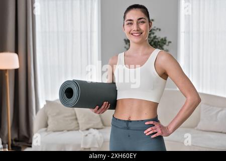 portrait of young woman  doing workout training at home Stock Photo