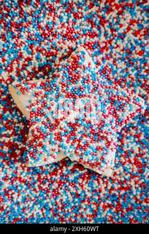 Star shaped sugar cookie with red, white and blue sprinkles Stock Photo