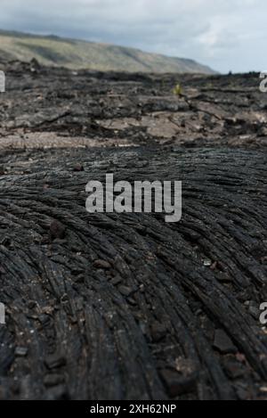 Close-up of dried lava rock over volcanic landscape in Hawaii. Stock Photo